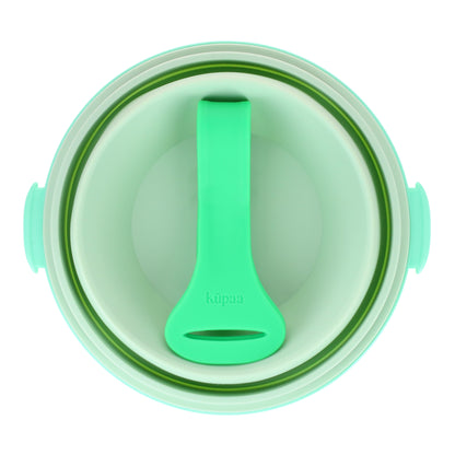 Green lunch box collapsed with the strap conveniently stored inside, front view.